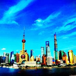 City skyline against cloudy sky