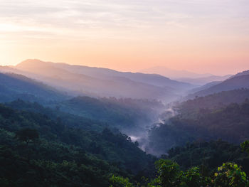 Beautiful nature of hills and mountain are complex with the atmosphere of the morning sunrise.