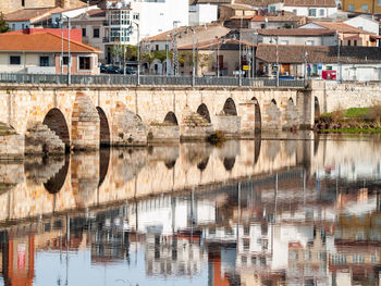 Reflection of bridge on river