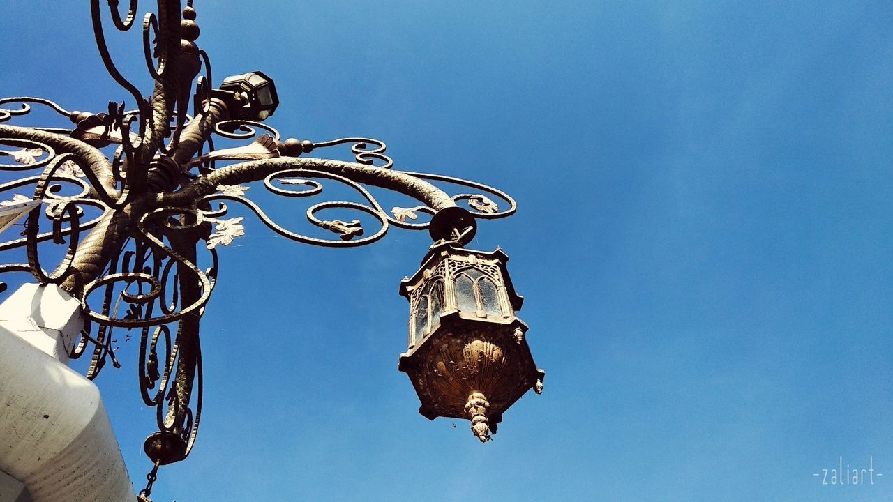 LOW ANGLE VIEW OF DECORATION AGAINST CLEAR SKY