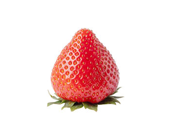 Close-up of strawberry over white background