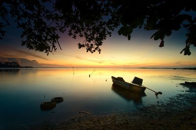 Scenic view of lake against sky during sunset