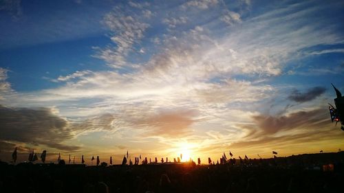 Silhouette of trees against sky at sunset