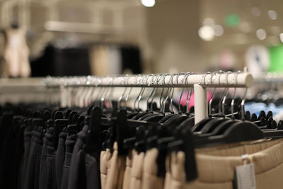 Close-up of clothes hanging on rack