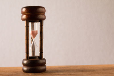 Close-up of hourglass on table