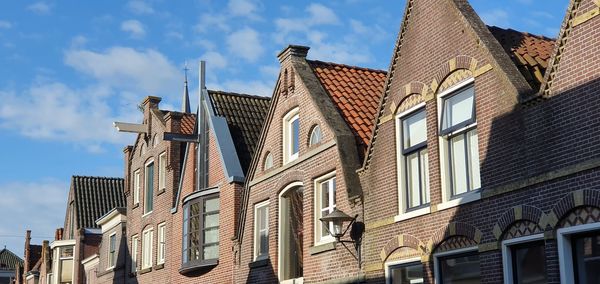 Low angle view of buildings against sky