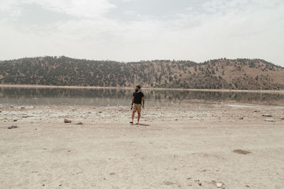 Full length of man on landscape against sky