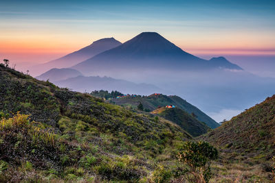 Scenic view of mountains against sky during sunrise