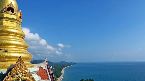 Cropped buddha statue of calm blue sea