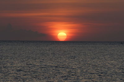 Scenic view of sea against romantic sky at sunset