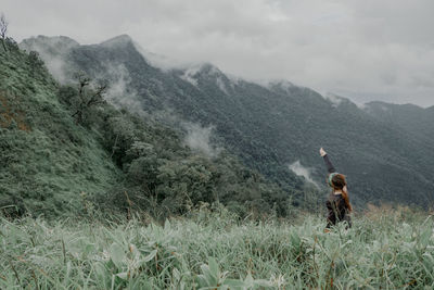 Panoramic view of people walking on mountain