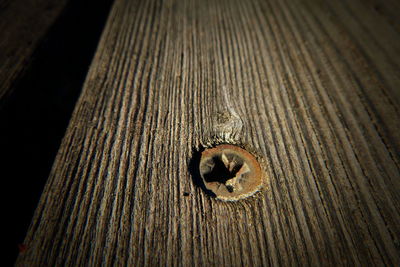 High angle view of old wooden plank on table