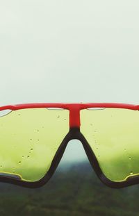 Close-up of sunglasses against clear sky