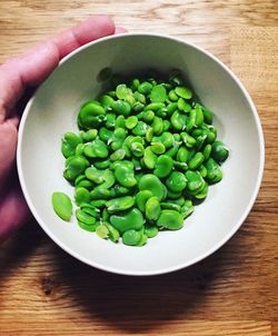 Directly above shot of green salad in bowl on table