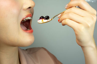 Midsection of woman eating food