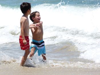 Friends enjoying at beach