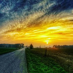 Scenic view of landscape against cloudy sky
