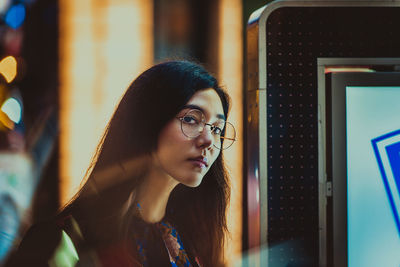 Portrait of young woman looking away