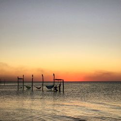 Scenic view of sea against clear sky during sunset