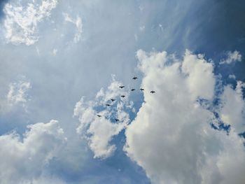 Low angle view of airplane flying in sky