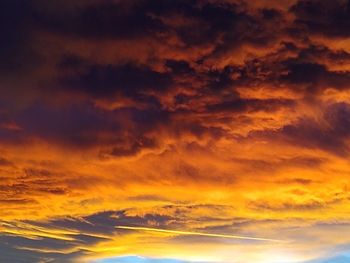 Low angle view of dramatic sky during sunset