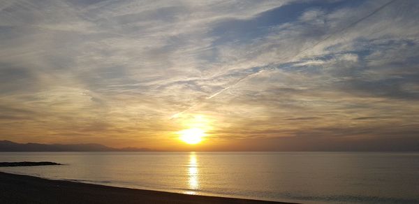 Scenic view of sea against sky during sunset