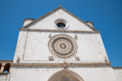 Low angle view of building against blue sky