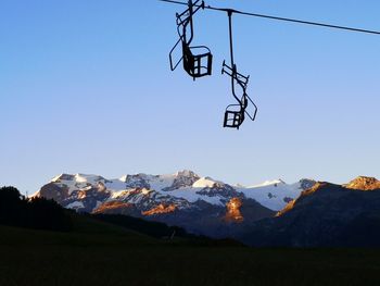 Scenic view of snowcapped mountains against clear blue sky