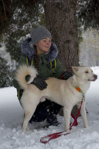 Girl with dog in winter