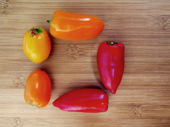 Close-up of wooden tomatoes on wooden table