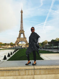 Full length of woman standing against sky