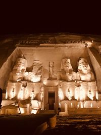 Statue in temple at night