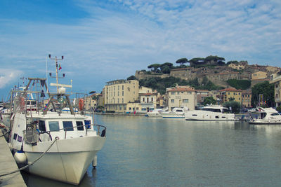 Boats in sea against sky