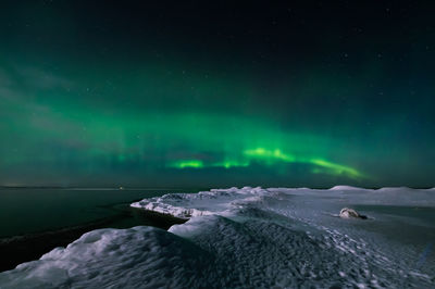 Scenic view of sea against sky at night