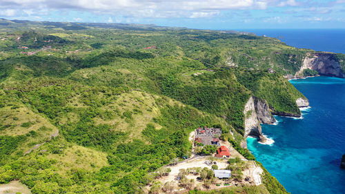 High angle view of sea and mountains against sky