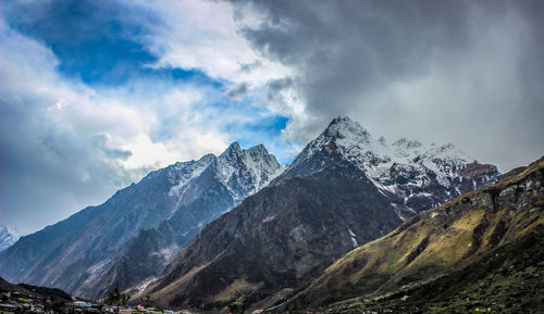 Scenic view of snowcapped mountains against sky