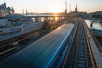 High angle view of railroad tracks against sky during sunset