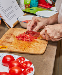 Cropped image of man preparing food on table