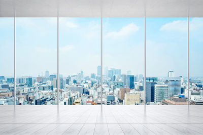 Modern buildings in city against sky