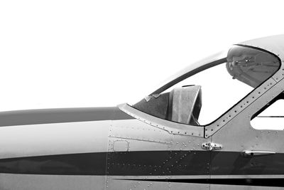 Close-up of airplane against clear sky