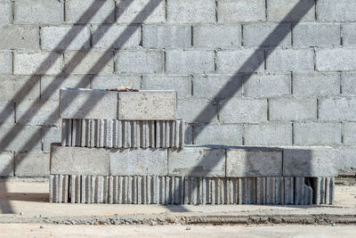 Shadow of railing on footpath