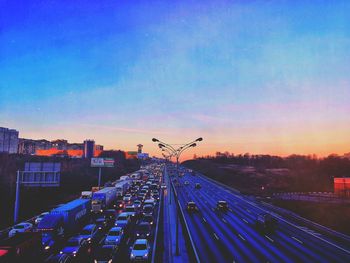 Panoramic view of road in city against blue sky