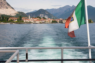 Scenic view of sea and mountains against sky