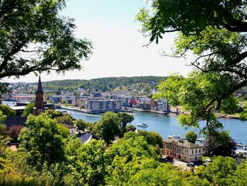 View of river in city against clear sky