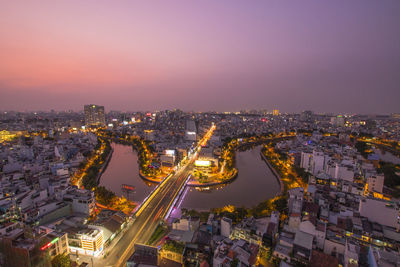 High angle view of illuminated city buildings at night