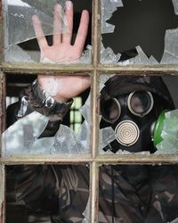 Full frame shot of man seen through glass window