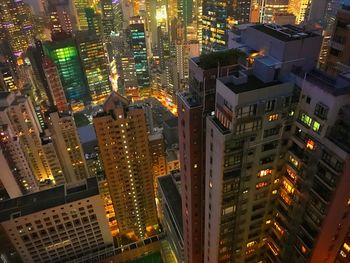 Aerial view of city lit up at night