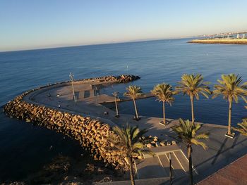 High angle view of footpath on groyne on sea