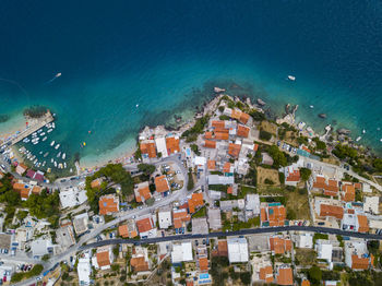 High angle view of buildings and sea in city