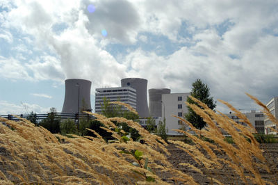 Buildings in city against sky